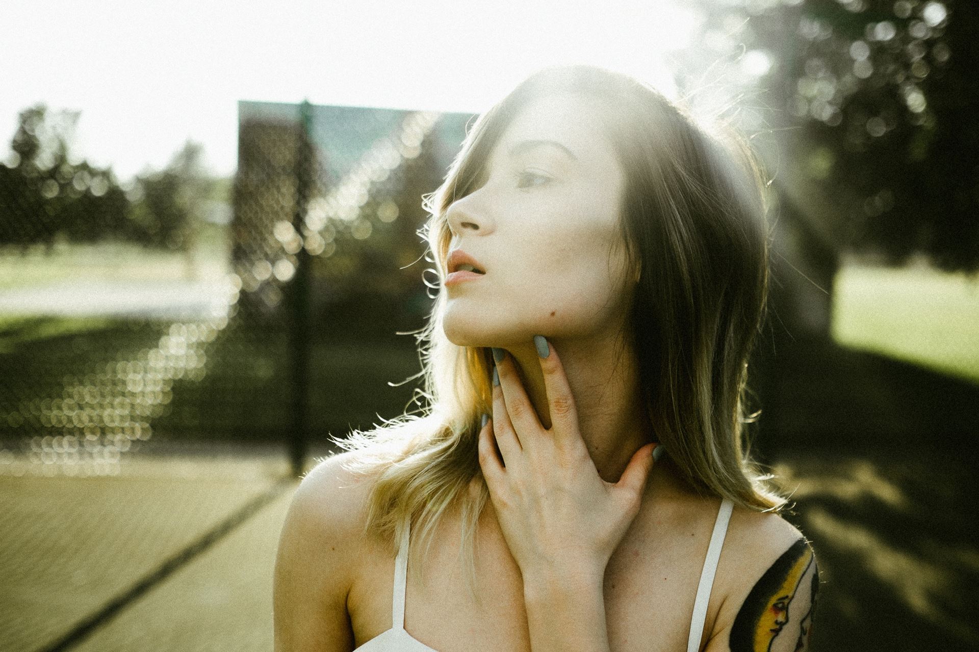 a woman touching her throat